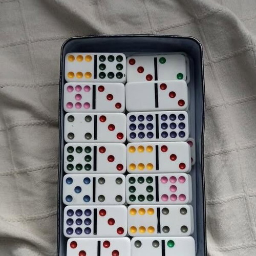 Domino board game used, complete with metal box