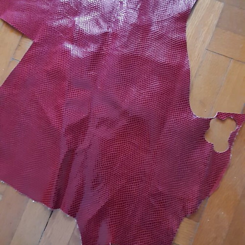 Leather with snake-like finish, slightly glossy, new