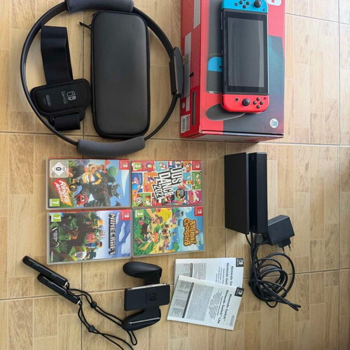 Nintendo Switch console bundle with 4 games and accessories