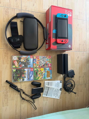 Nintendo Switch console bundle with 4 games and accessories