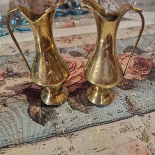 Brass pitchers set like new with carved designs and natural patina