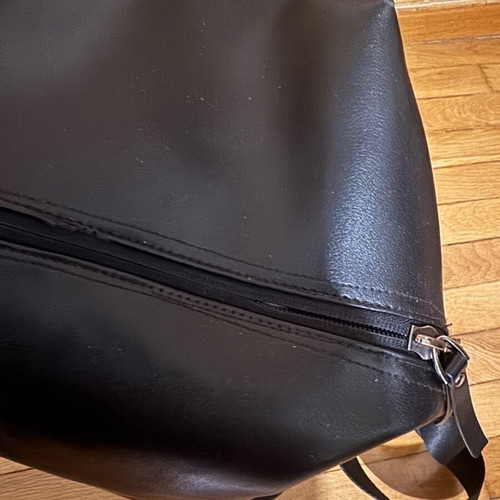 Leather backpack like new, black with orange lining