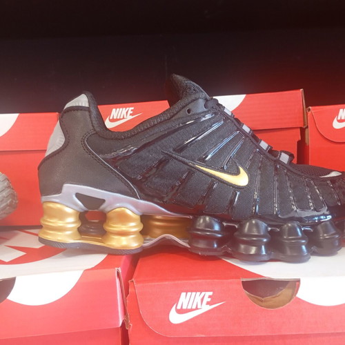 Nike Shox athletic shoes new, black and gold
