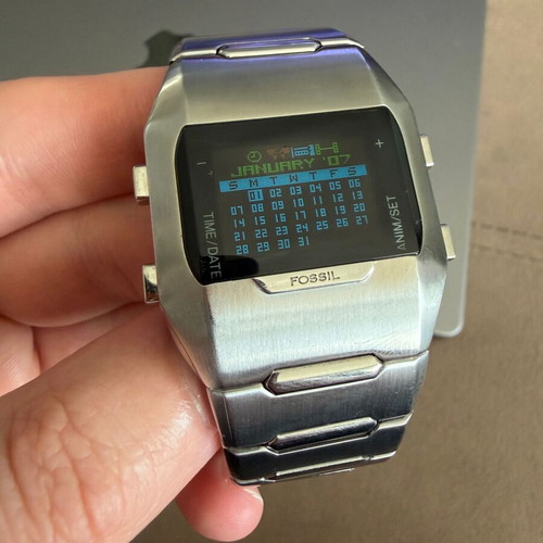 Fossil OLED JR-9465 watch like new, unisex, silver metal band