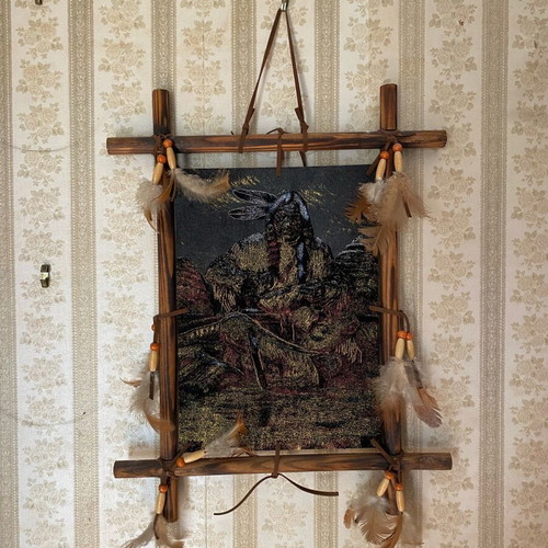 Wall decor like new with Native American figure and feathers