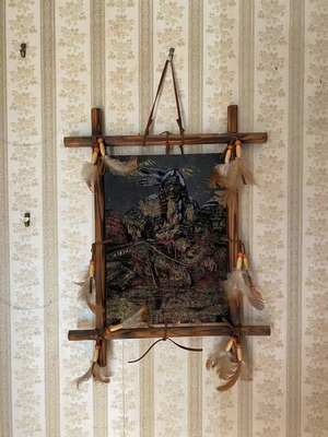 Wall decor like new with Native American figure and feathers