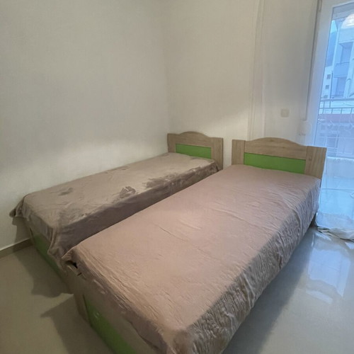 Wooden single beds with mattresses like new, set of 2
