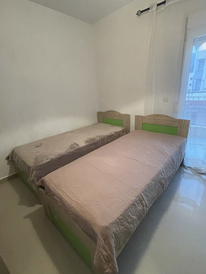 Wooden single beds with mattresses like new, set of 2