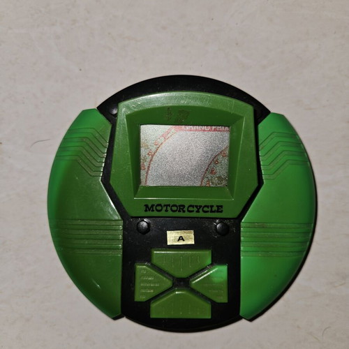Vintage 1990s handheld LCD electronic game, motorcycle theme