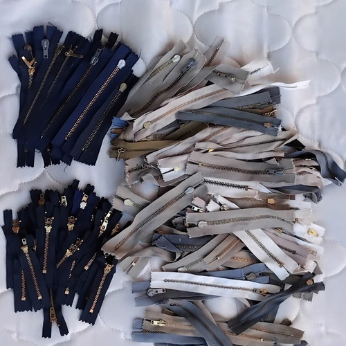Metal and plastic sewing zippers YKK, assorted colors and sizes, pack