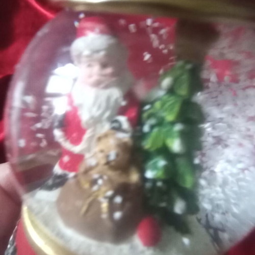 Christmas souvenir like new with Santa Claus and falling snow