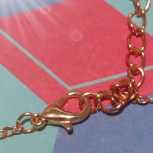 Gold-colored heart bracelet with chain