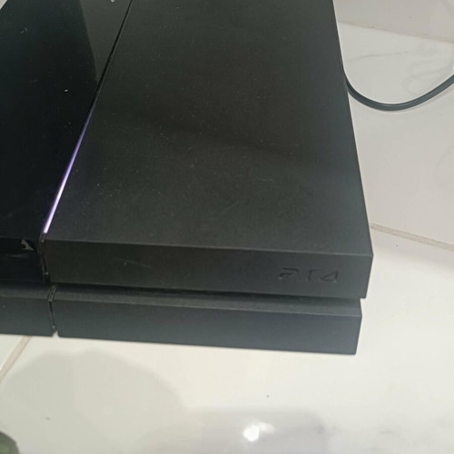 PlayStation 4 console with 2 controllers and cables