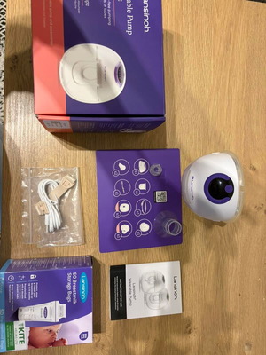 Portable breast pump like new with accessories and storage bags