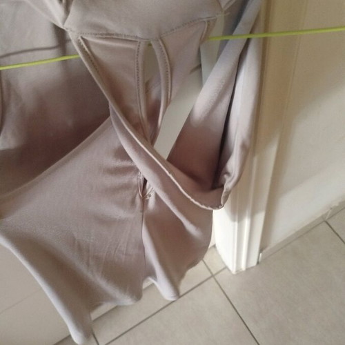 Sleeveless blouse with twisted design beige, like new, sizes S/M