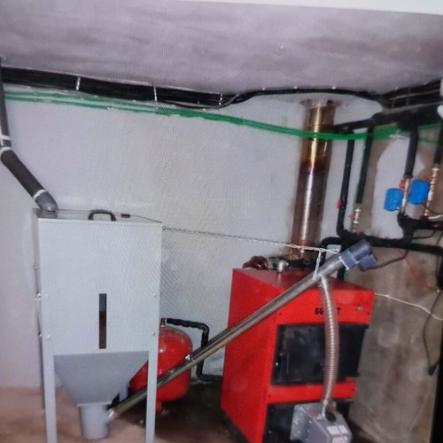 Pellet and wood boiler used with silo