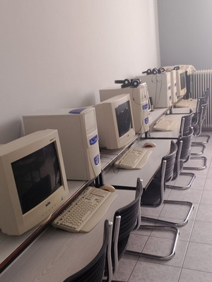 Set of 7 retro Windows ME computers used with CRT monitors, keyboards, and mice