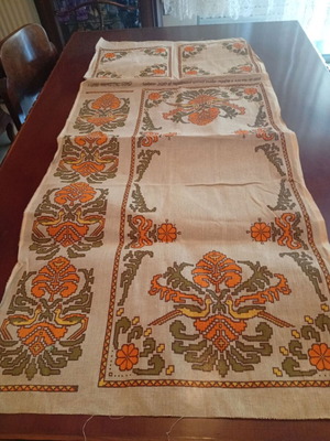 Unstitched table linen set with runner and two squares on canvas