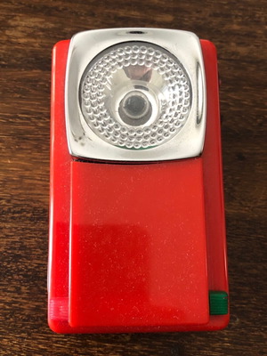Vintage old-style flashlight like new with red and green light