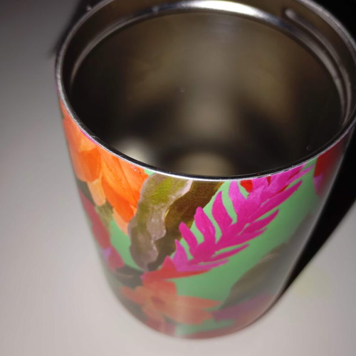 Thermos for coffee used, tropical colors