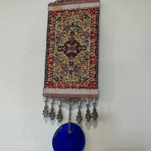 Vintage handmade wall amulet with oriental rug and glass eye 32x10