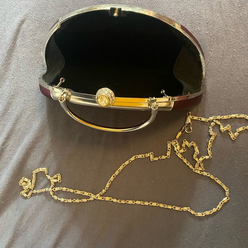 Evening handbag with extra chain for crossbody wear