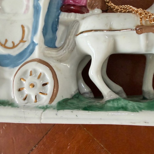 Porcelain figurine carriage like new, small crack