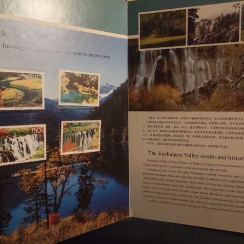 Collectible gold-bound volume with China stamps and photos