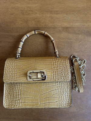 Yellow leather bag with bamboo strap