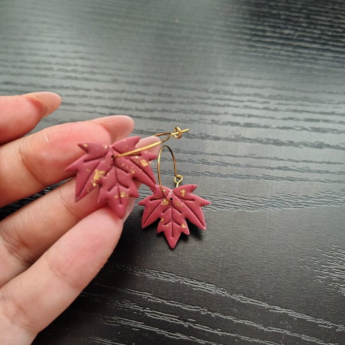 Red and gold leaf-shaped dangle earrings