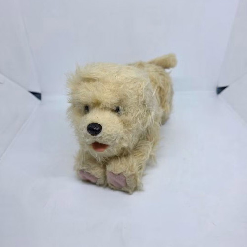 Plush dog toy that moves and makes sounds