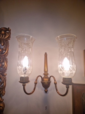 Vintage pair of two-light wall sconces made of bronze used