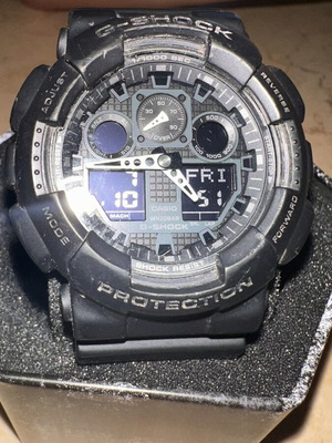 Casio G-Shock GA-100 watch like new with box and papers
