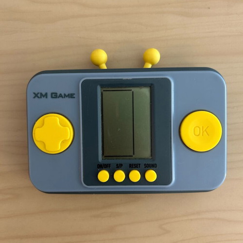 Vintage XM Game handheld console with multiple games