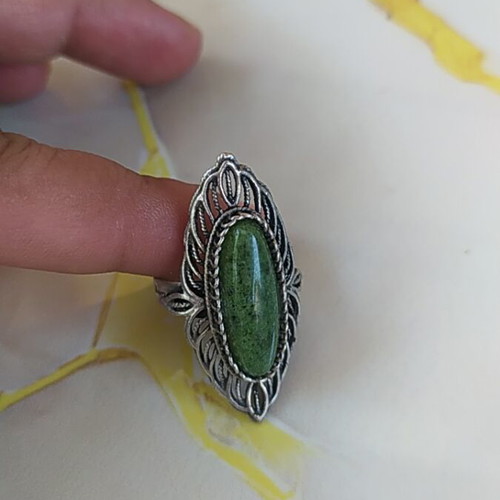 Women's ring new with green stone