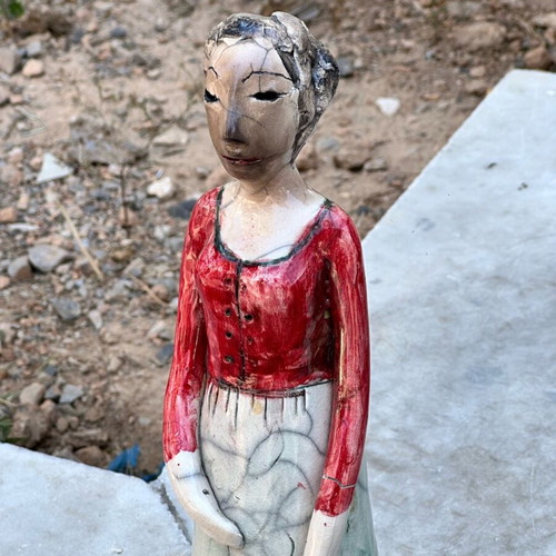Handmade artistic ceramic woman statue used with rustic style