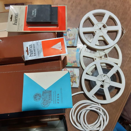Pycb film projector used, with leather case and 3 children's cartoons