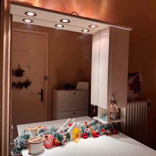 White furniture used with mirror and drawers
