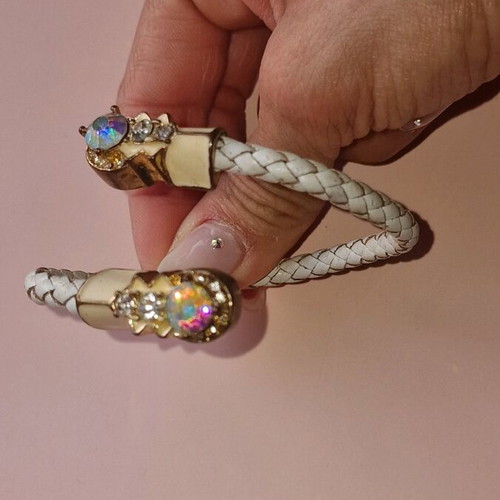 Bracelet made of white leather with gold clasps used