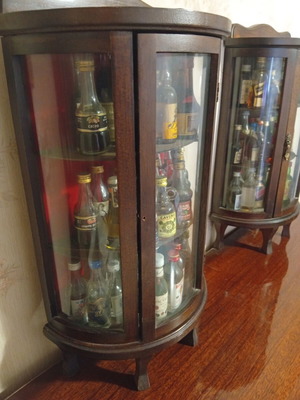 Vintage set of 86 mini liquor bottles with 2 wooden glass display cabinets