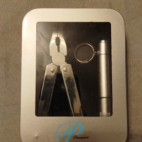 Multitool and flashlight set in metal box new unused