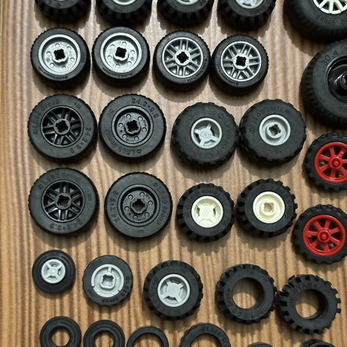 Lego wheels set like new, 65 parts including tires and inner pieces