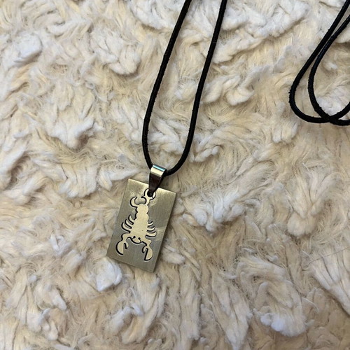 Scorpio zodiac necklace like new stainless steel with leather cord