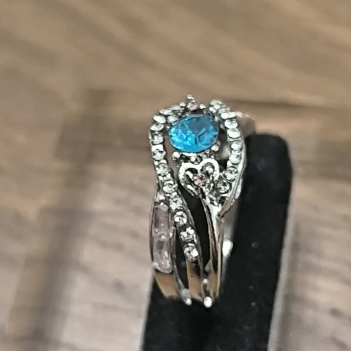 Silver vintage ring with blue zircon and white stones