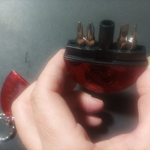 Multi tool keychain with flashlight, tape measure and 4 screwdriver bits