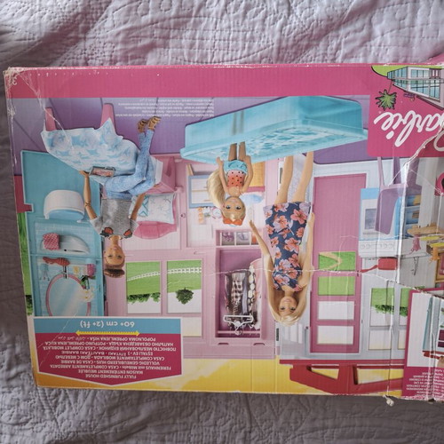 Barbie dollhouse used with box, dolls and accessories