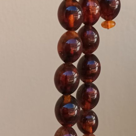 Pressed olive amber worry beads used, 38 g, 21 beads