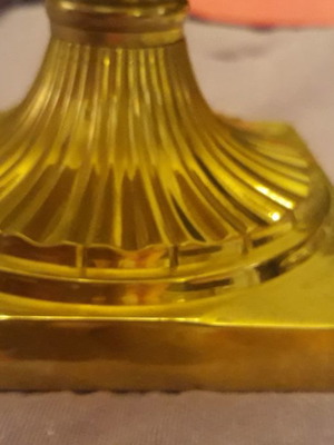 Solid brass candlestick with beeswax candle used