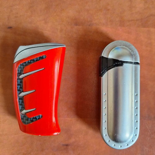Set of 2 vintage collectible lighters, grey metal and red racing