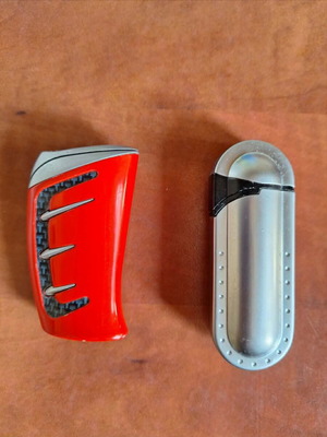 Set of 2 vintage collectible lighters, grey metal and red racing
